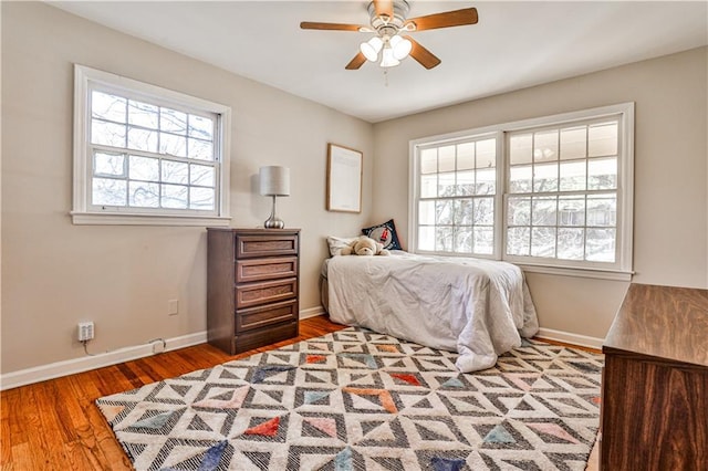 bedroom featuring hardwood / wood-style flooring and ceiling fan