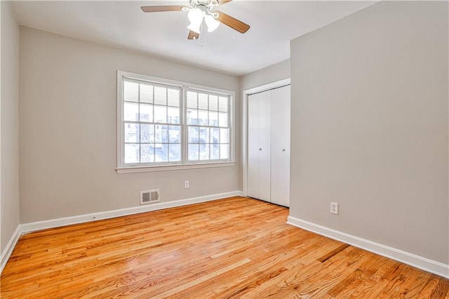 interior space with ceiling fan and light hardwood / wood-style flooring