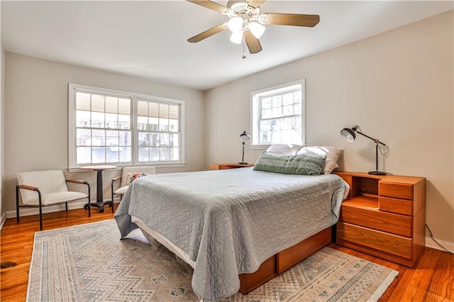 bedroom featuring hardwood / wood-style floors and ceiling fan