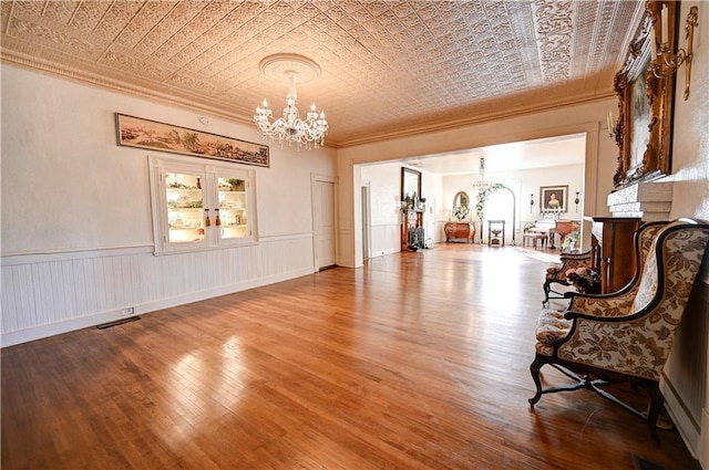 sitting room with a fireplace and hardwood / wood-style floors