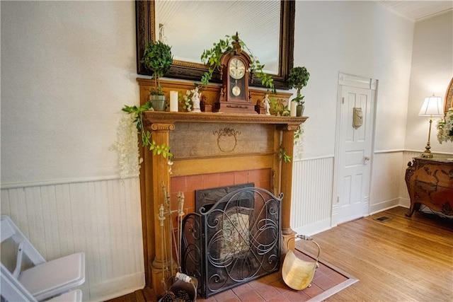 living area with a fireplace and hardwood / wood-style flooring