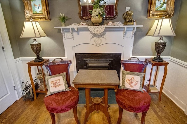 sitting room featuring wood-type flooring