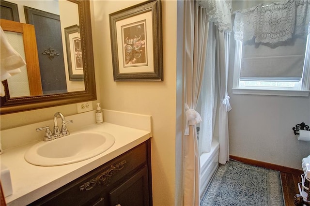 bathroom featuring tile patterned floors, vanity, and shower / bathtub combination with curtain