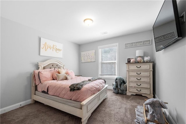 bedroom with carpet, visible vents, and baseboards