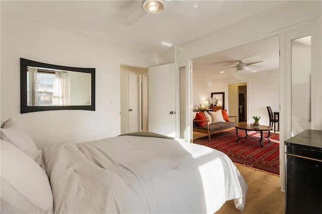 bedroom featuring ceiling fan and wood finished floors