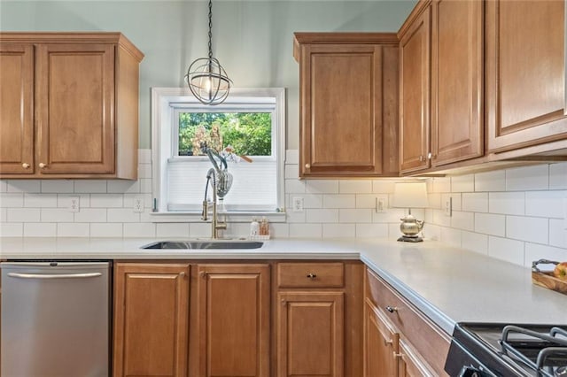 5415 Fieldfreen Dr, Cumming, GA 30028 - kitchen featuring dishwasher, a sink, brown cabinetry, range, and decorative backsplash