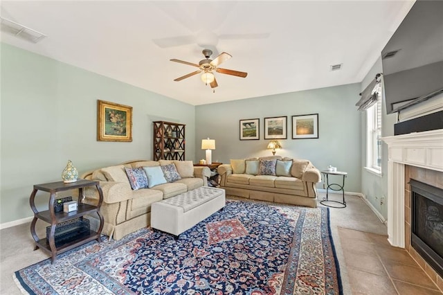 5415 Fieldfreen Dr, Cumming, GA 30028 - carpeted living area featuring ceiling fan, a fireplace, and baseboards