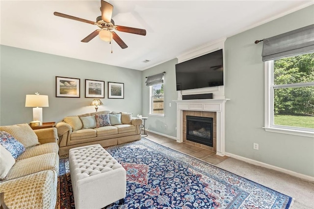 5415 Fieldfreen Dr, Cumming, GA 30028 - carpeted living room with plenty of natural light, ceiling fan, a tiled fireplace, and baseboards