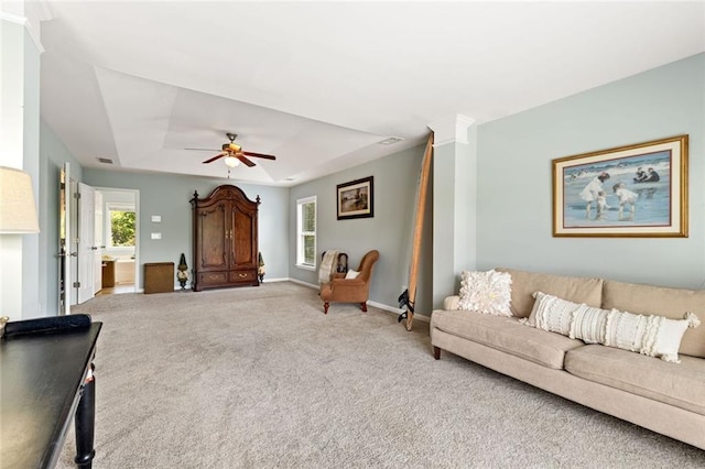 5415 Fieldfreen Dr, Cumming, GA 30028 - carpeted living area with healthy amount of natural light, a raised ceiling, ceiling fan, and baseboards