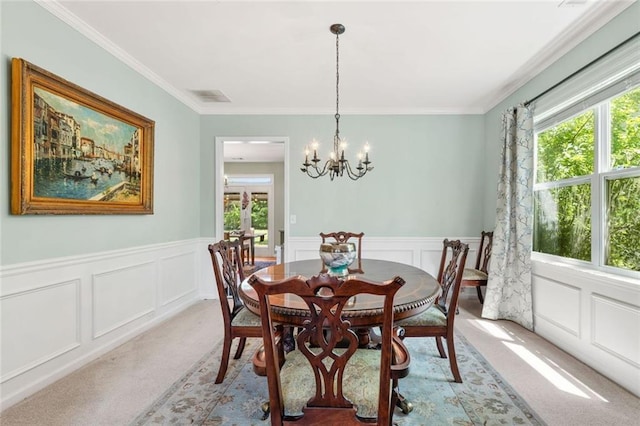 5415 Fieldfreen Dr, Cumming, GA 30028 - dining space featuring light carpet, healthy amount of natural light, a chandelier, a decorative wall, and ornamental molding