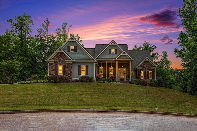 craftsman house featuring a lawn