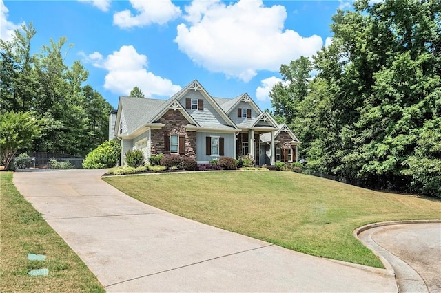 craftsman-style house with a front lawn