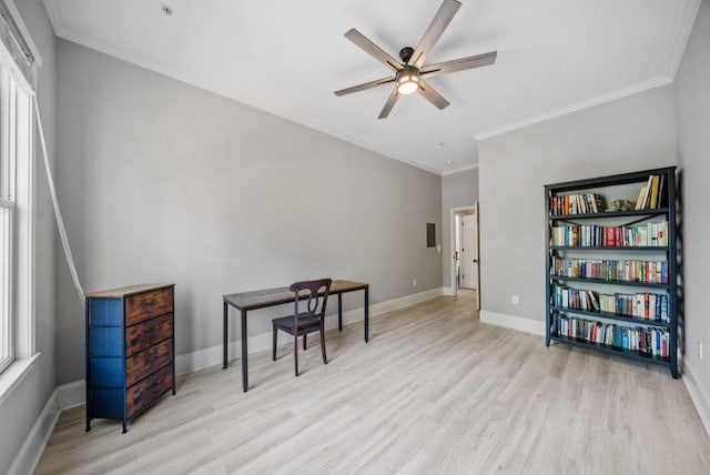 sitting room with light wood-type flooring, ceiling fan, and ornamental molding