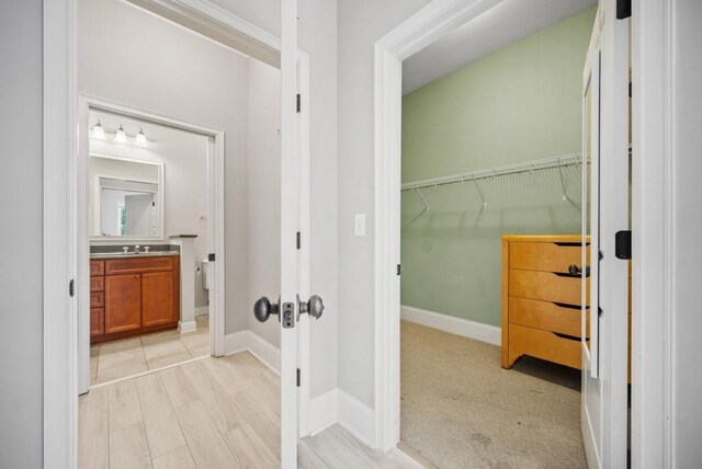 bathroom featuring hardwood / wood-style flooring and vanity