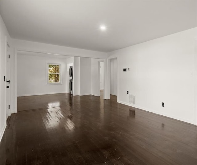 empty room with dark hardwood / wood-style flooring