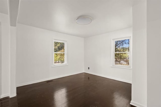 empty room featuring dark hardwood / wood-style floors