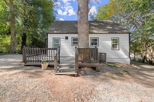 back of property featuring a wooden deck and central AC unit