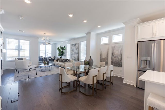 dining area with recessed lighting, a notable chandelier, baseboards, dark wood-style floors, and crown molding