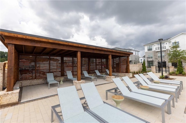 view of patio featuring fence