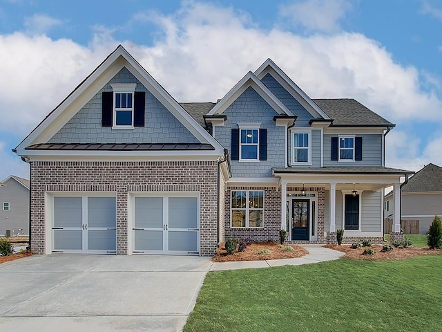 craftsman-style house with a front lawn, a garage, and covered porch