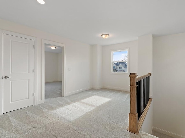 empty room featuring light colored carpet