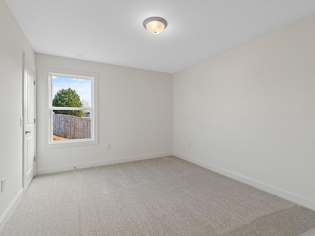 empty room featuring light carpet