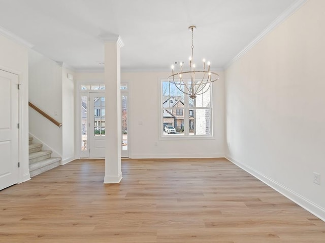 unfurnished dining area featuring crown molding, a notable chandelier, and a healthy amount of sunlight