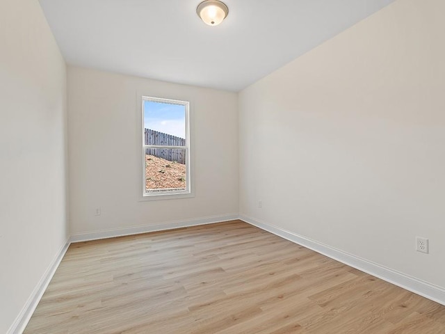 spare room with light hardwood / wood-style flooring