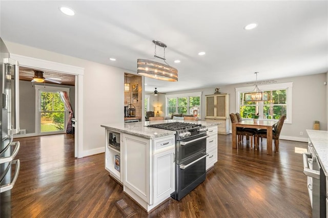 1382 Varner Rd, Marietta, GA 30062 - kitchen featuring range with two ovens, a ceiling fan, healthy amount of natural light, and recessed lighting