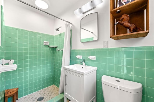 1382 Varner Rd, Marietta, GA 30062 - bathroom with tile walls, vanity, tiled shower, toilet, and a wainscoted wall