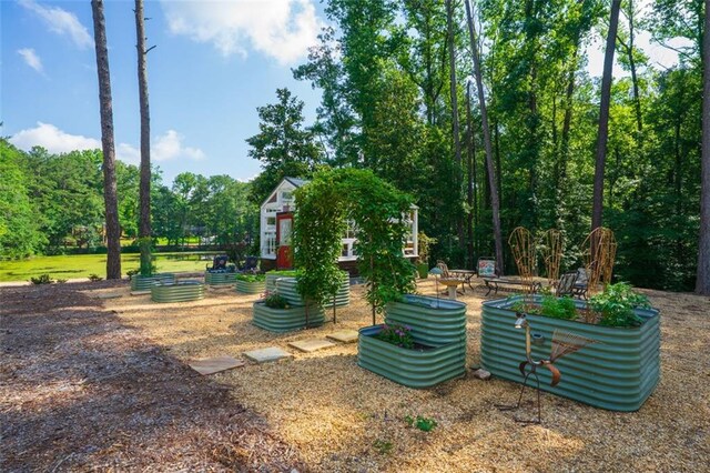 1382 Varner Rd, Marietta, GA 30062 - view of home's community featuring a vegetable garden and an outdoor structure