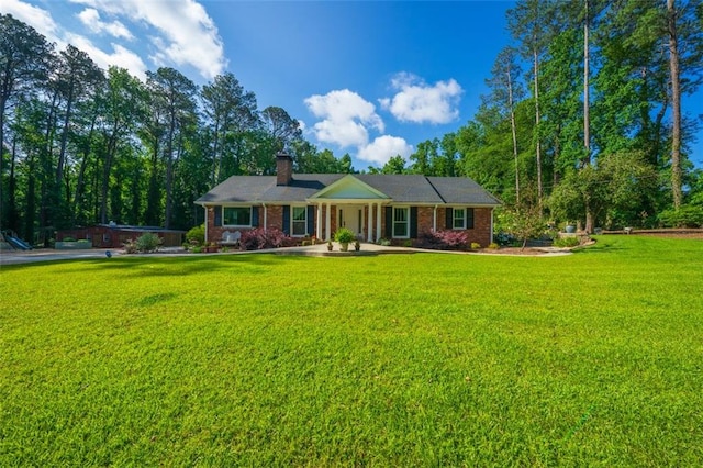 1382 Varner Rd, Marietta, GA 30062 - ranch-style home featuring a chimney, a front lawn, and brick siding