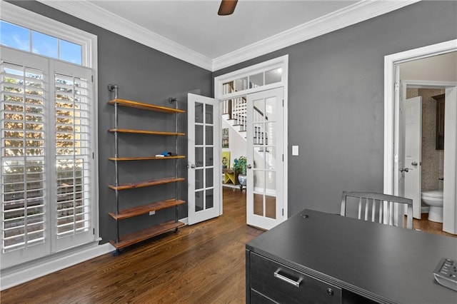 office with french doors, ceiling fan, crown molding, and dark wood-type flooring