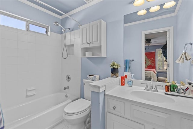 full bathroom with crown molding, vanity, toilet, and tiled shower / bath combo