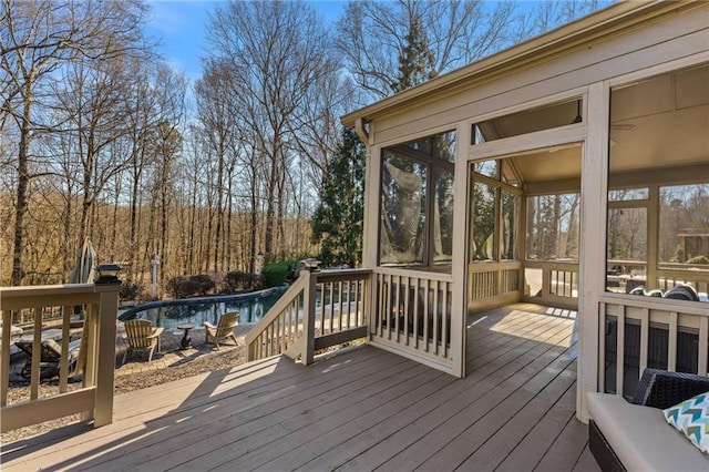 wooden terrace featuring ceiling fan and an outdoor hangout area