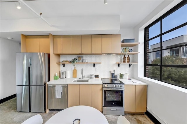 kitchen with tasteful backsplash, a sink, open shelves, and stainless steel appliances