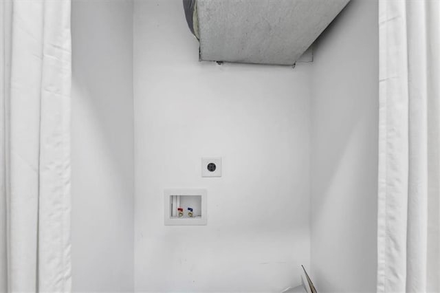 clothes washing area featuring electric dryer hookup, hookup for a washing machine, and laundry area