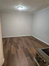 spare room with dark hardwood / wood-style floors