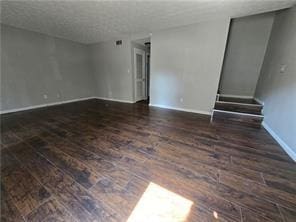 unfurnished room with dark hardwood / wood-style floors