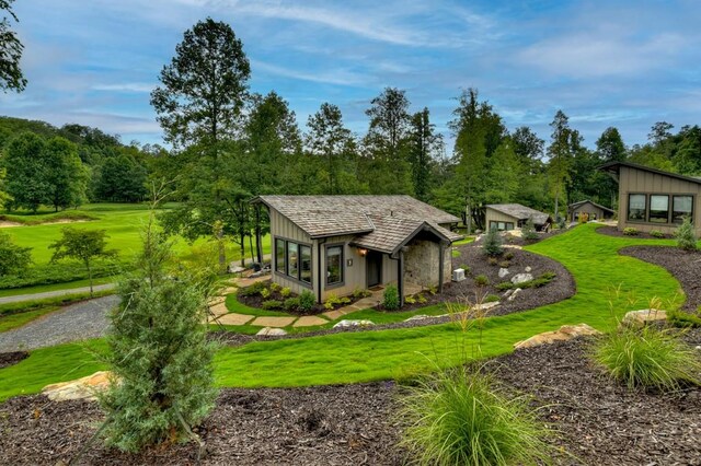 view of property's community with a lawn