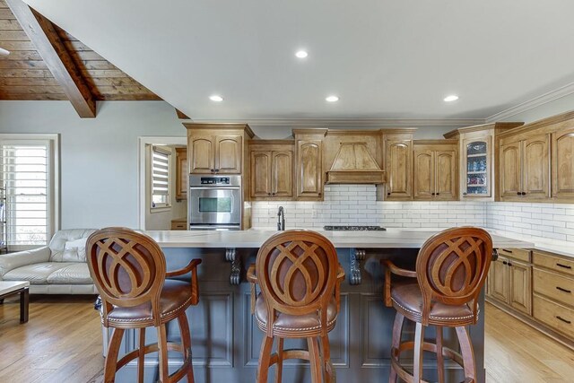 486 Gold Bullion Dr E, Dawsonville, GA 30534 - kitchen with glass insert cabinets, light countertops, double oven, light wood-type flooring, and beam ceiling