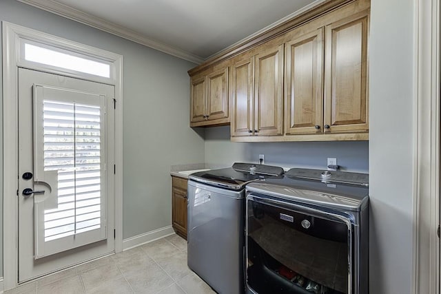 486 Gold Bullion Dr E, Dawsonville, GA 30534 - laundry area with cabinet space, washing machine and clothes dryer, crown molding, light tile patterned floors, and baseboards