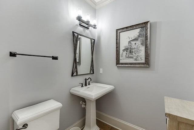 486 Gold Bullion Dr E, Dawsonville, GA 30534 - bathroom featuring ornamental molding, toilet, and baseboards