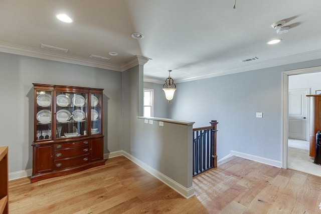 486 Gold Bullion Dr E, Dawsonville, GA 30534 - corridor featuring light wood-style flooring, crown molding, recessed lighting, baseboards, and an upstairs landing