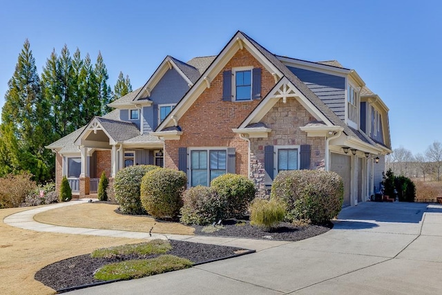 486 Gold Bullion Dr E, Dawsonville, GA 30534 - craftsman house featuring concrete driveway, a garage, stone siding, and roof with shingles