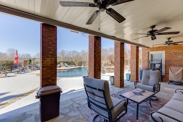 486 Gold Bullion Dr E, Dawsonville, GA 30534 - view of patio featuring ceiling fan and an outdoor pool