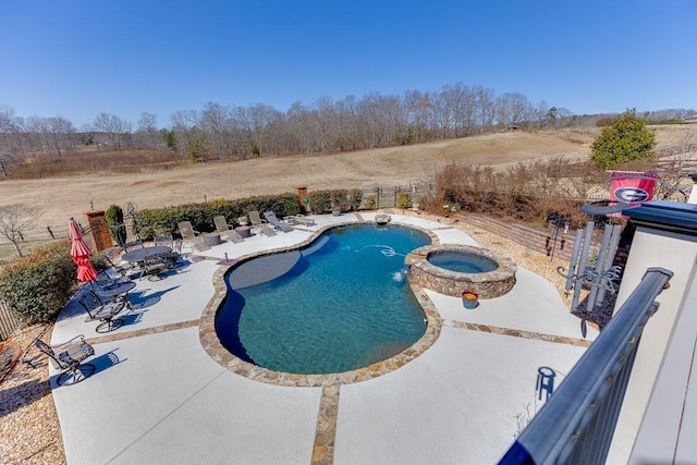 486 Gold Bullion Dr E, Dawsonville, GA 30534 - view of swimming pool featuring a patio area, a fenced backyard, and a pool with connected hot tub