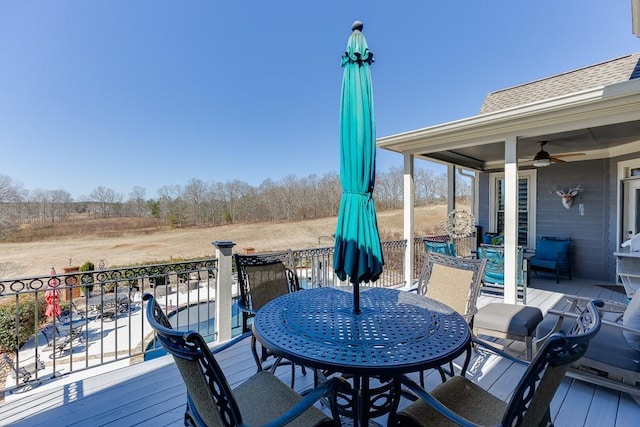 486 Gold Bullion Dr E, Dawsonville, GA 30534 - deck with ceiling fan and outdoor dining space