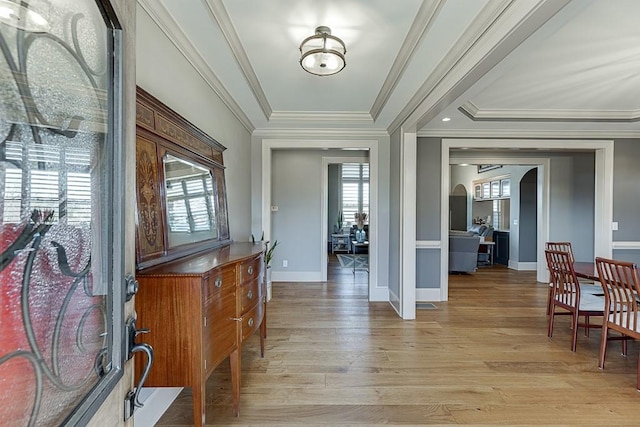 486 Gold Bullion Dr E, Dawsonville, GA 30534 - entryway featuring light wood finished floors, baseboards, ornamental molding, and arched walkways