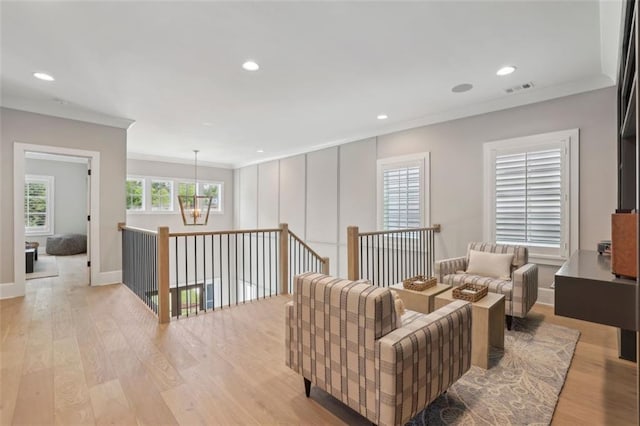 2583 Apple Valley Rd, Brookhaven, GA 30319 - living area featuring crown molding, light wood-style floors, recessed lighting, and baseboards